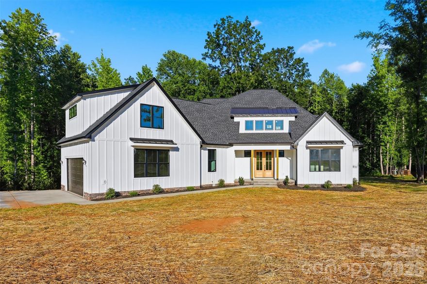 Welcome to a rare and highly sought-after opportunity in the Sanders Landing community. Nestled on 1.8 acres in a private cul-de-sac and zoned for the Clover School District, this beautifully crafted home offers luxury, comfort, and thoughtful design throughout.
The open-concept layout features soaring vaulted ceilings, oversized windows, and an abundance of natural light. The chef’s kitchen is designed to impress with a large quartz island, walk-in pantry, ample cabinetry, and a functional range hood.
The spacious primary suite offers elegant coffered ceiling details, a luxurious bathroom, and a walk-in closet. The bathrooms showcase upscale finishes, including a garden tub, walk-in shower, and LED defrosting mirrors.
Upstairs, a versatile flex space provides endless possibilities for an office, playroom, bonus room, or creative retreat, complete with multiple walk-in storage areas.
This home perfectly blends luxury finishes with everyday practicality in one of Clover’s most desirable communities.
IMAGES ARE VIRTUALLY RENDERED TO RESEMBLE WHAT THE HOME COULD LOOK LIKE WHEN COMPLETED. EXPECTED COMPLETION DATE IS MAY-15-2026