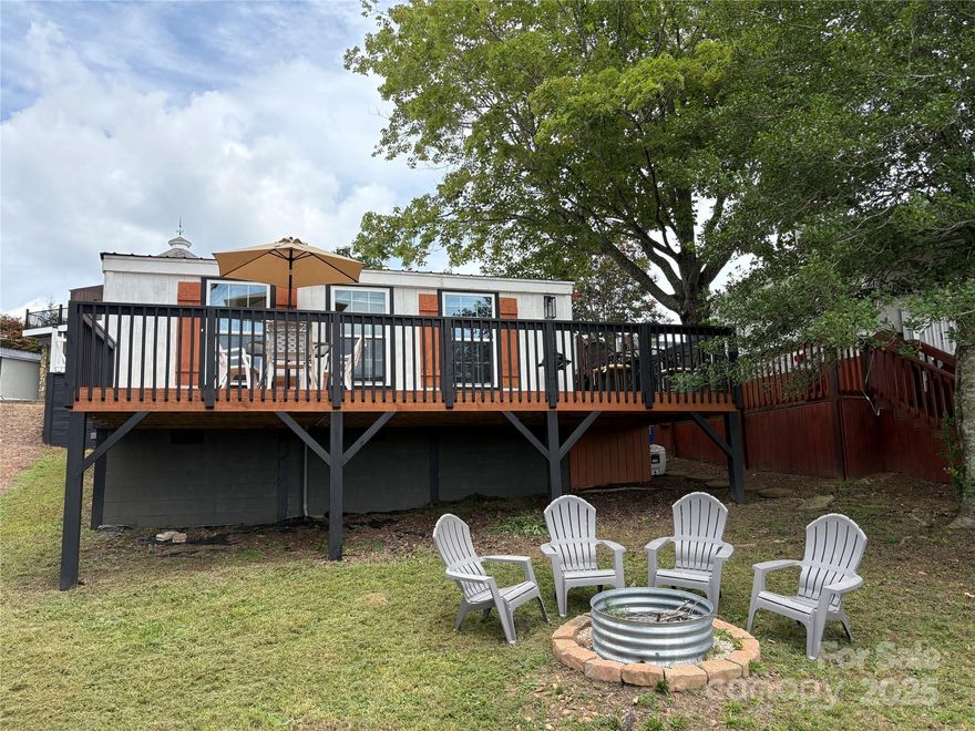 Come enjoy the lake view from this remodeled camper with stick-built room addition (built 2021) on a deeded lot inside the gated waterfront community of Badin Shores Resort at Badin Lake.  A new roof was installed on the camper in 2021, new deck in 2021, heating/air just months ago, all new full bath with tub/shower combination, new 1/2 bath, new kitchen with modern electric smooth surface stove, large deep sink, butcher block counter tops, & room for 6 to dine!  The camper features (bedroom #1) two twin beds with newer memory foam mattresses, the room addition features a bedroom with queen custom headboard...wake up & enjoy the lake view out your bedroom window.  A spacious deck & yard offer plenty of room for entertaining your guest around the firepit or while enjoying a game of cornhole.  This beautiful property comes with most interior furnishings & decor. Come enjoy Badin Shores Resort & all the fantastic amenities the resort offers.