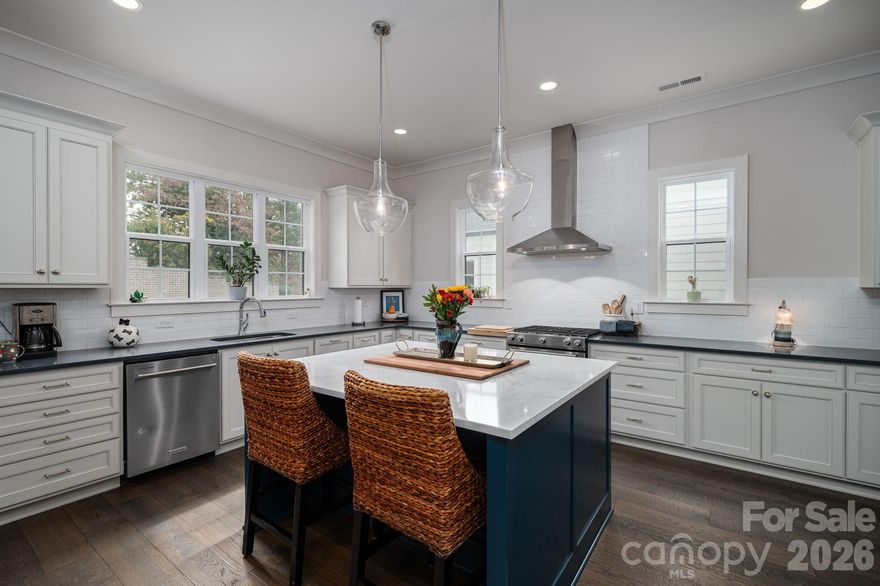 Just moments from the vibrant heart of Belmont’s Main Street, this exceptional home offers the best of both worlds—unmatched convenience paired with a surprising sense of privacy. Enjoy being just seconds from dining, boutique shopping, parks, and year-round community events, all while tucked into a setting that feels peaceful and removed from the hustle.

The community enhances everyday living with HOA-maintained landscaping and land care, allowing for a low-maintenance lifestyle. Residents also enjoy shared green spaces and have access to several nearby parks, perfect for relaxing, gathering, or enjoying the outdoors.

Inside, the home showcases high-end finishes throughout, including thoughtfully incorporated architectural details crafted from materials sourced from historic Belmont—blending timeless character with modern design. The chef’s kitchen offers generous counter space and refined finishes, ideal for both everyday living and entertaining. The main level features 10-foot ceilings and an inviting living room centered around a gas-log fireplace, with direct access to a spacious screened-in patio—perfect for relaxing evenings, hosting friends, or enjoying the game. A dedicated dining room, private study, and full bathroom provide excellent flexibility for guests, remote work, or multi-purpose living.

Upstairs, 9-foot ceilings highlight the impressive primary suite with a walk-around soaking tub, walk-in shower, and ample storage. A large loft spans the length of the upper level, offering space for a media room, home office, or recreation area, while three additional bedrooms complete the home.

This is a rare opportunity to enjoy upscale comfort, low-maintenance living, and a prime Belmont location that keeps you connected—yet comfortably tucked away.