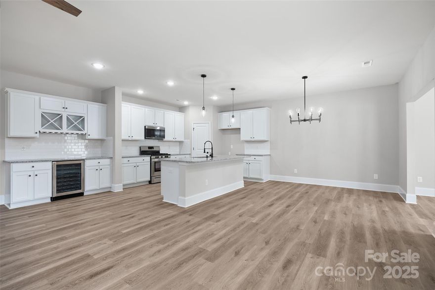 An incredible Single Family Attached "Duet Style" home with NO HOA dues or HOA restrictions on what you can create in your very own backyard Oasis!  Extremely desirable area in Charlotte! Enjoy stylish modern/craftsman finishes, luxury vinyl plank flooring on the main level, and luxury tile in all baths and the laundry room. This spacious layout features 4 bedroom Bright white and soft gray tones creating a fresh, inviting atmosphere. The builder is offering up to $10,000 to buyers at closing, if a preferred lender is used, making this an unbeatable opportunity. SC Homes delivers desirable upgrades at an affordable price—don’t miss your chance to own beautiful private space. Discover your dream home today! All interior photos are representation photos. Some options are not offered on these homes.