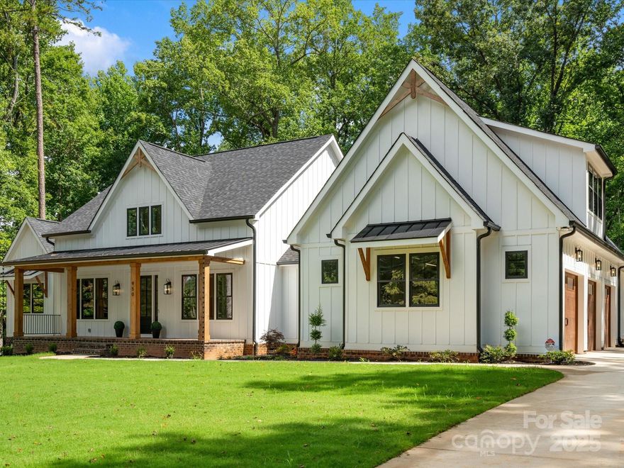 Beautiful custom home on over an acre at the end of a lovely street. Perfectly positioned beside the 17th green & 18th tee box of a Donald Ross-designed Fort Mill Golf Course. The moment you enter, exquisite craftsmanship, soaring ceilings & thoughtful details shine throughout. A chef-inspired kitchen with a commercial range, an elegant dining space with an arched wine wall, and a study with fluted paneling create an atmosphere of sophistication. The great room features wood-beamed vaulted ceilings, an electric fireplace, and telescoping sliders that open seamlessly to an expansive covered porch with a gas fireplace ideal for indoor-outdoor living. The primary suite is a private retreat featuring a spa-like bath, a custom walk-in closet, an electric fireplace, & direct porch access. A versatile bonus room features a wet bar, full bath, & walk-in closet, providing space for guests or a fourth bedroom. This modern cottage is thoughtfully designed for both comfort and exceptional living.