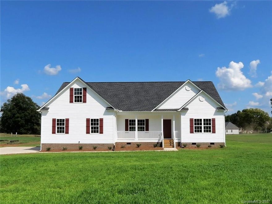 Beautiful new construction on over an acre of land.  Home has hardwoods throughout the living area and granite in the kitchen and bathrooms.  Large bonus above the 2 car garage for added space that could be used for an office.  Covered back porch looks over the large backyard.  Home is a 3 bedroom 2 bath and has a split floor plan.