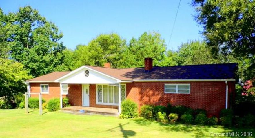 Lots of room in this brick- 3bed/2bath Ranch with basement, with 1.8 acres in a peaceful country setting. Enjoy a BBQ on the multi level composite deck with family and friends. Large kitchen & lots of cabinets. Need extra space? Check out the unfinished basement with garage door for your boat or collector car. Attached- single carport & hardwood floor under carpet in Mstr. Heat pump and solar heating. Insulated windows, gas log fireplace, whirlpool bathtub and a rocking chair front porch!