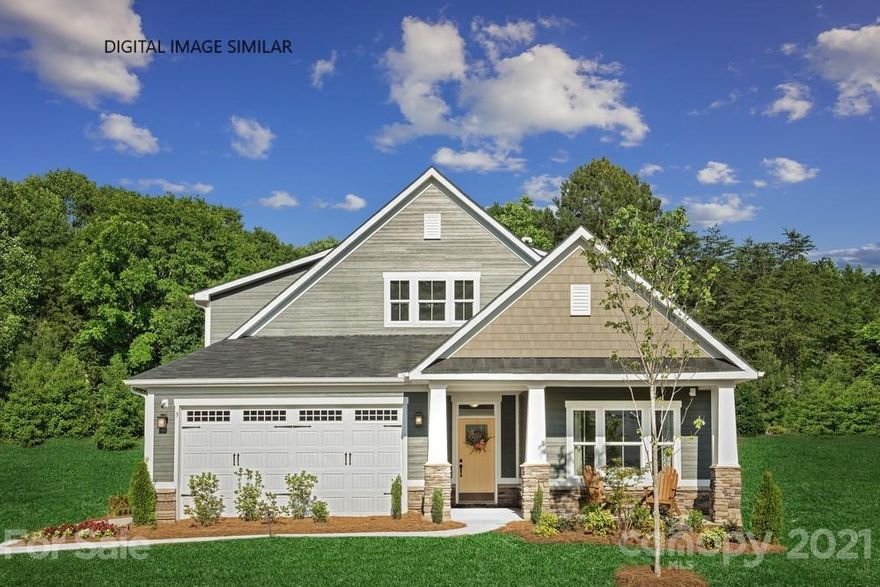 Sophisticated one and a half story home located in Union county in a great central location to Indian Trail, Waxhaw, Matthews & South Charlotte.  This generous single family home features a stylish interior and the community features wooded homesites with included lawn maintenance.  The Palladio has everything you need.  The kitchen is bright and open with a walk in pantry and an oversized island that overlooks the expansive dining and great room.  The owner’s suite is serene and features a large walk in closet and en-suite bath. Located on the second floor is a secluded bedroom and full bath plus a functional loft great for movie night or a game room. The possibilities are endless.   Best of all relax outdoors on the sprawling covered porch.  Moore Farm will feature miles of natural walking trails and a Farm House style clubhouse and pool.  HOME IS TO BE BUILT. DELIVERY DATE IS SUBJECT TO CHANGE.