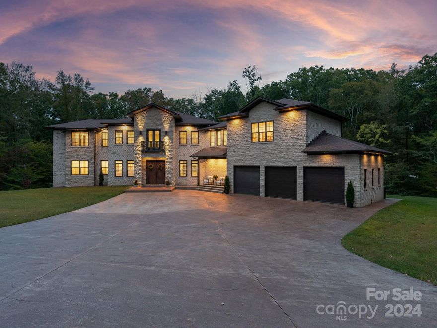 Welcome to this stunning newer contemporary home located on a scenic 1+ acre lot in beautiful Weddington. With 5 bedrooms & 7.5 baths, this home offers ample space for luxurious living. Step inside the light-filled interior, with floor-to-ceiling windows that flood the home with natural light. The heart of the home is the kitchen, complete with quartz island w/waterfall edge & built in KitchenAid fridge. Kitchen also features a full scullery kitchen with additional oven, dishwasher & sink + plenty of pantry space. Primary on main with his & her custom walk-in closets & luxury bathroom including vessel tub, spa shower with digital controls & heated tile floors. The fully finished walk-out basement features 10-foot ceilings, gas fireplace, sauna, & rec room & 2 full baths + flex room. Upstairs, features 3 secondary rooms, each with attached full bath. Separate in-law suite offers a full kitchen, family room, bedroom, & full bath. Located just 5 minutes south of Waverly shopping!