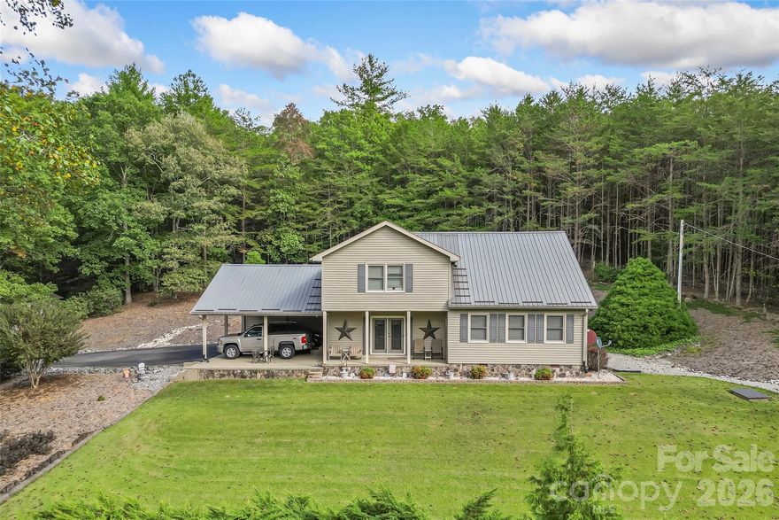 Peaceful mountain living near South Mountains State Park! This well-maintained 2BR/2BA home sits on 8.58 private wooded acres across two lots and has been lovingly cared for by its original owners since 1989. The highlight of the 2,172 sq ft home is the impressive great room featuring a large stone fireplace, exposed beams, and a tongue-and-groove ceiling that creates a warm mountain lodge feel. The spacious kitchen offers abundant cabinetry and a center island for prep and gathering. Outside, enjoy beautifully maintained landscaping, privacy, and room to explore. The property also includes a 2-car attached carport and a 320 sq ft shed with power, ideal for a workshop or additional storage. Convenient to hiking, waterfalls, and outdoor recreation at South Mountains State Park while offering the quiet and privacy of country living.