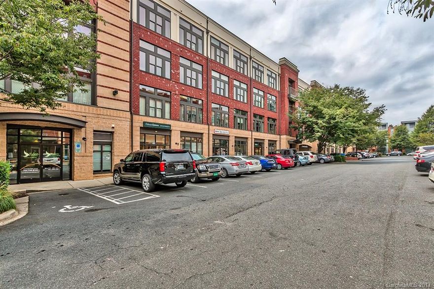 Urban living in a loft-style condo in desirable Southend! Top floor unit walkable to breweries, shopping, and dining. Open plan with high ceilings, flooded in natural light, hardwood on the main floor, granite countertops, included stackable laundry and refrigerator, fresh paint, newly installed carpet, and a gated attached parking deck. Lower level has a huge master bedroom with a large walk-in closet and double vanity in a white tiled en suite bathroom.