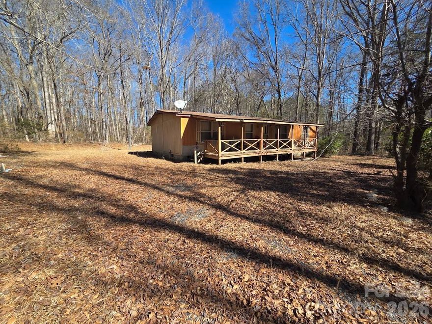 Set on 1.82 acres, this private property offers a blend of partial clearing, mature trees, and established landscaping, creating a peaceful and versatile setting. The lot provides a balance of open space and natural buffer, ideal for those seeking privacy without complete seclusion.

Key improvements are already in place, including a well, septic system, and an existing shed, adding functional value to the property. A double-wide manufactured home is currently located on-site; however, due to the presence of organic growth inside the home, the seller is not permitting interior access. The property is being sold as-is, and no value is being assigned to the existing home.

The manufactured home has not been deemed uninhabitable by any authority. An investor or buyer with renovation experience may determine the condition is within their scope of work. Alternatively, the existing structure may be removed, and per York County, SC, placement of a new manufactured home is permitted, offering an excellent opportunity for redevelopment or replacement.

This property presents a flexible opportunity for investors, builders, or buyers looking for land with utilities already installed—saving time and upfront costs—while allowing the freedom to reimagine the site to suit their vision. Quiet, private, and full of potential.

***For safety reasons, no interior access is permitted at time of showings***