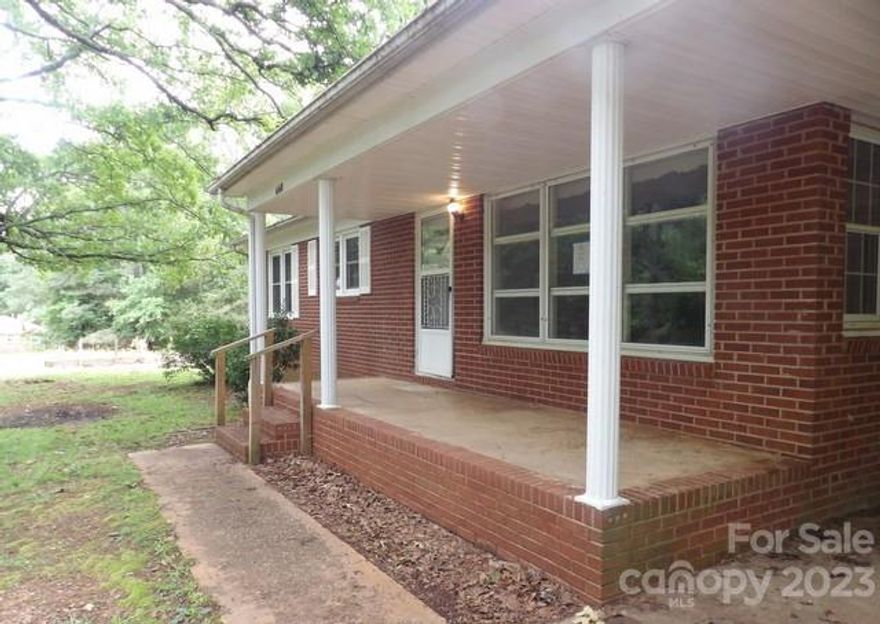 Amazing opportunity for a sweat equity project!  Midcentury brick ranch with architectural details.   Beautiful hardwood floors in the living room and all bedrooms.  Large lot with mature trees.  The work at home or hobbyist will love the huge outbuilding with plenty of room for everything you can imagine.  A second smaller outbuilding would make a great she shed or can be great storage.  A definite must see!