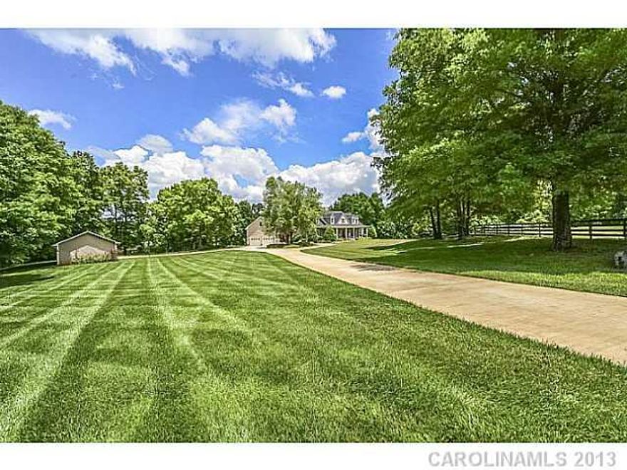 Beautiful Country Estate with Guest House, Private Lake & Acreage!  "Mountain Lodge" vaulted Great Room with beautiful cedar paneling, floor to ceiling stone fireplace.  Master & Guest suites plus Study on main level.  2108 sf Guest House with master on main attached by breezeway!  Screened porch, boat house, separate carport/workshop! Additional 10 acres & horse barn also available for purchase.