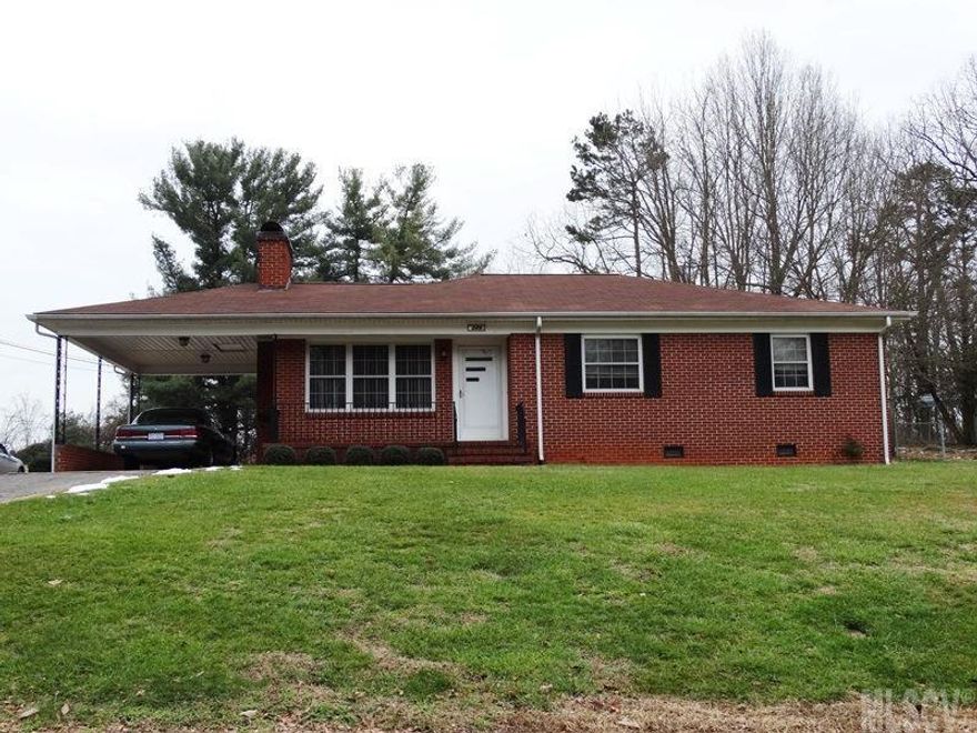 Original owner & extremely well-maintained all brick ranch with partial basement on nice .57 acre lot! Large front porch, single carport & extra parking area. Living room with beautiful hardwood floors & wood burning fireplace with tile hearth. Large open kitchen with dining area & laundry hook-ups. Hardwood floors in wide hallway with curved wall corner. All 3 bedrooms are good sized with ample closet space. Hardwoods in 2 bedrooms & MBR offers small half bath. Spacious hall bath with linen closet. Partial unfinished basement; large level backyard with storage building; replacement windows; new water heater.