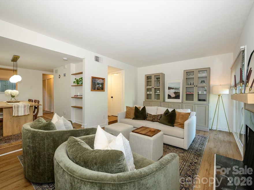 Adorable 2-story END UNIT condo in an unbeatable SouthPark location! This charming and well-maintained home offers an open-concept living and dining space, thoughtfully refreshed throughout with stylish designer touches. Enjoy new LVP flooring throughout, plus smooth ceilings for a clean, modern feel. The kitchen stands out with glazed countertops, stainless steel appliances and eye-catching floating wood shelves that blend function and style. The inviting living area features a wood-burning fireplace and a stylish hutch with glass-front cabinets and lower drawers for added storage. A spacious dining area easily accommodates a table for six—perfect for everyday living or entertaining. Upstairs, the primary suite offers a walk-in closet, a separate vanity area, and a private en-suite bath. Both full bathrooms have been updated with new vanities, lighting, mirrors and plumbing fixtures. The secondary bedroom also features a walk-in closet, providing excellent storage. Outdoor living is a true highlight, featuring three distinct spaces to enjoy—a patio off the living area, a private balcony off the primary bedroom, and an enclosed 12x8 patio with a storage closet. Additional upgrades include new windows throughout and new sliding glass doors with screens. Refrigerator, washer, and dryer convey. Unbeatable location just minutes to SouthPark shopping and dining. Turnkey, low-maintenance living in one of Charlotte’s most sought-after areas—don’t miss this one!