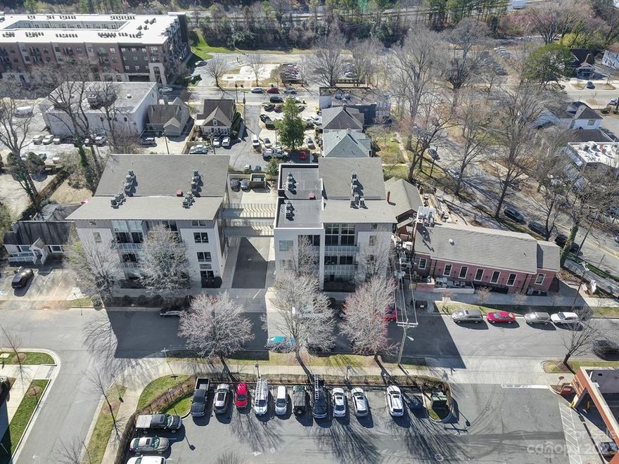 Welcome to condo living in the heart of Plaza Midwood! This 1 Bed 1 Bath unit offers an industrial, contemporary, artsy feel. Gorgeous hardwood floors throughout, 12' ceilings, laundry room, and reserved off-street parking. The kitchen features  granite countertops, beautiful cabinetry, and stainless steel appliances. The private patio is perfect for entertaining or relaxing.  HOA covers water, sewer, exterior landscaping and pest control. Conveniently located within minutes of Supperland, Legion Brewing, Whiskey Warehouse, Undercurrent Coffee, Workman's Friend, Milkbread, Thomas Street Tavern and much more.  There is a trolley stop near Moo & Brew and there is a proposed Light rail Silver Line down Central Avenue.