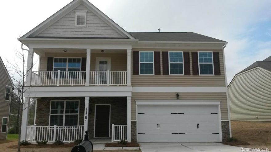 Located in North Charlotte this is a gorgeous brand new four bedroom home with a loft. Gleaming hardwood floors throughout the first floor, large decorative pillars divide the formal living and dining room.  The kitchen has a large pantry, granite counter tops, an island and opens to the eat in area and spacious great room. All bedroom are located upstairs , the master suite has a huge walk in closet, over sized garden tub, stand up shower and entrance to the second story balcony!