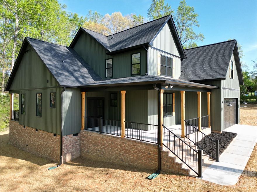 Welcome to this stunning new construction 1.5-story home offering just over 2,300 square feet of thoughtfully designed living space in a highly desirable neighborhood. Situated on a spacious 0.61-acre lot, this home perfectly blends modern style with comfortable living.

Step inside to find an open-concept floor plan featuring a beautifully appointed kitchen with granite countertops, custom cabinetry, a large center island, and sleek stainless steel appliances—ideal for both everyday living and entertaining. The kitchen flows seamlessly into the main living area, where a cozy fireplace creates a warm and inviting focal point.

The main level offers a functional layout with a primary suite and additional living space, while the upper level provides flexibility for bedrooms, a bonus area, or home office.

Outside, enjoy the charm of a welcoming covered front porch with wood accents, perfect for relaxing evenings. The home’s exterior showcases a tasteful combination of modern siding, brick foundation, and clean architectural lines, all complemented by a private, generously sized lot.

With 3 bedrooms, 2.5 bathrooms, and quality craftsmanship throughout, this home delivers the perfect combination of style, space, and location.