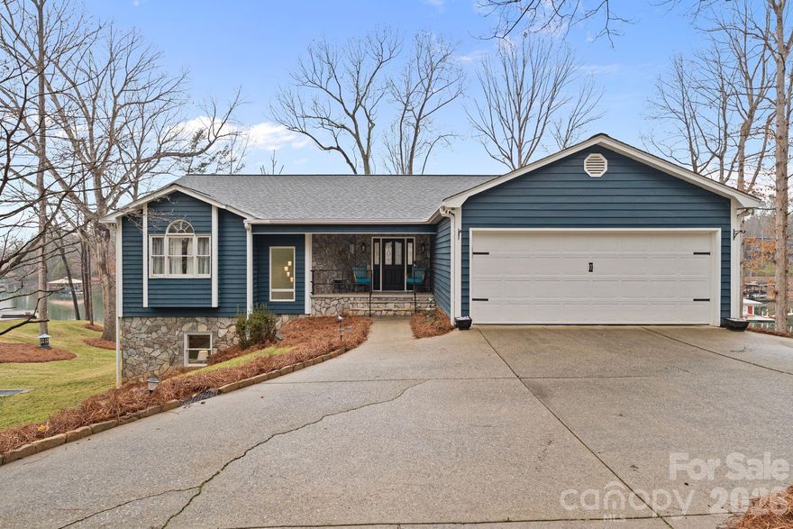 Welcome to this beautiful lakeside retreat nestled on 2.66 acres offering 400' of Lake Norman shoreline. This 5-bedroom, 3-bath ranch home with a fully finished walk-out basement offers a thoughtful blend of comfort, space, and modern updates. Refined landscaping, a new deck, and inviting curb appeal set the tone upon arrival. Inside, the open-concept main level flows seamlessly from the kitchen to the living room, featuring refinished hardwood floors, stainless steel appliances, and a spacious kitchen island ideal for everyday living and entertaining.
The main level includes a primary suite, guest bedroom, full bath, a sunroom/office, and laundry room, providing true one-level living convenience. The fully finished lower level expands the living space with a large bonus room featuring a wood-burning fireplace, 3 additional bedrooms, and flexible areas for recreation or gatherings. Multiple storage rooms including a wet storage area, ideal for waterfront living needs making lake days easier. Outdoor spaces are designed to maximize the lake lifestyle, offering a main-level deck, covered lower patio, dedicated fire pit seating area, and a covered dock with boat lift. The 2.66-acre lot provides additional usable land with potential space for future storage buildings, RV parking, or a detached garage - the possibilities are endless. A rare opportunity to enjoy peaceful Lake Norman living with room to relax, entertain, and create lasting memories.