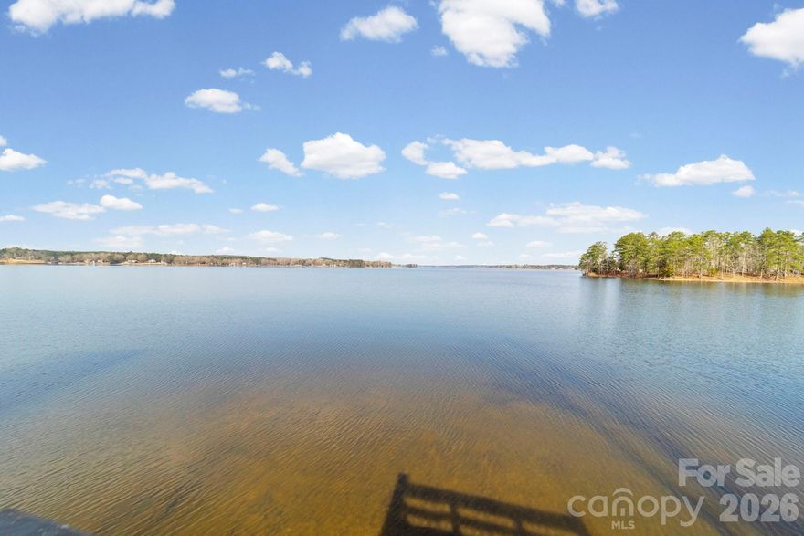 Breathtaking panoramic views of the main channel framed by Spanish moss–draped oak trees create a setting that truly leaves you speechless. This exceptional home offers four spacious bedrooms, three of which feature stunning water views and/or private access to either the upper balcony or lower patio—perfect for enjoying morning coffee or evening sunsets. Designed for comfort and gathering, the open main living area showcases beautiful round-pegged hardwood floors and natural lighting. There’s abundant space for family, friends, and guests to relax and unwind. An attached side-entry double garage, along with a detached storage shed, provides ample room for vehicles, tools, and recreational gear. Partially fenced yard. Park the boat on your private pier with covered boat lift and don't forget your fishing poles!