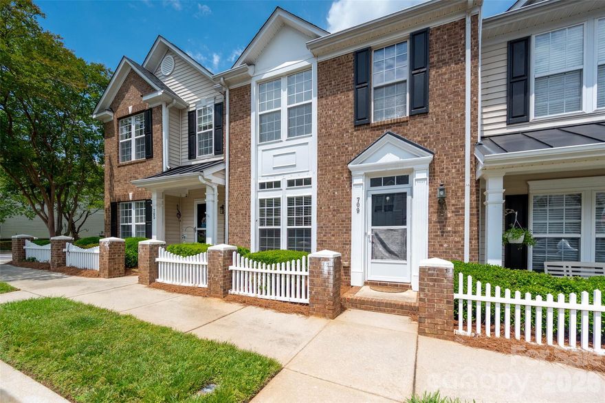 Well maintained 2 bedroom, 2.5 bath townhome. The open floor plan  is perfect for entertaining with beautiful updated flooring, a large living room up front, & big kitchen/breakfast at the back. In between there is a sunny dining/flex room which could easily convert into your home office. The spacious kitchen features an island with breakfast bar, lots of cabinets & counter space.  Upstairs the large primary suite has a tray ceiling and walk-in closet & the bath includes a double vanity. The second bedroom is huge with a big closet. New Roof 2023. Heating system 2025. Ac 2016 per previous owner. The back yard includes two-car parking with a privacy fence along the sides and a storage shed. Plenty of guest parking out front. Take advantage of the community pool for summer fun! Conveniently located near Target, shopping & dining options & I-77.
