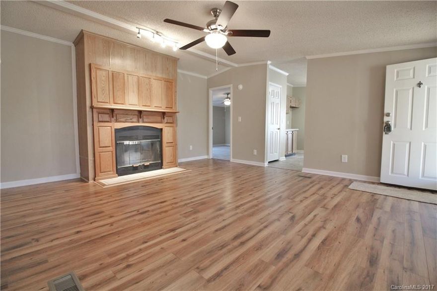 WELCOME HOME!Completely Remodeled!Relax After a Hard Day on Your Brand New Private Covered Front Porch~Great Rm w/Wood Fireplace & Beautiful New Wood Laminate Flooring!New Carpet~New Vinyl~Kitchen w/New Counters~New Stove~All New Lighting & Ceiling Fans~Remodeled Bths w/New Vanities~New Shower/Tubs~New HVAC~Fresh Paint Thruout~2 New Decks~All New Skirting~New Landscaping~12x16 Wired Workshop~ Fantastic Lake Wylie Area w/Close Proximity to New YMCA/Aquatic Center~Award Winning Clover Schools!