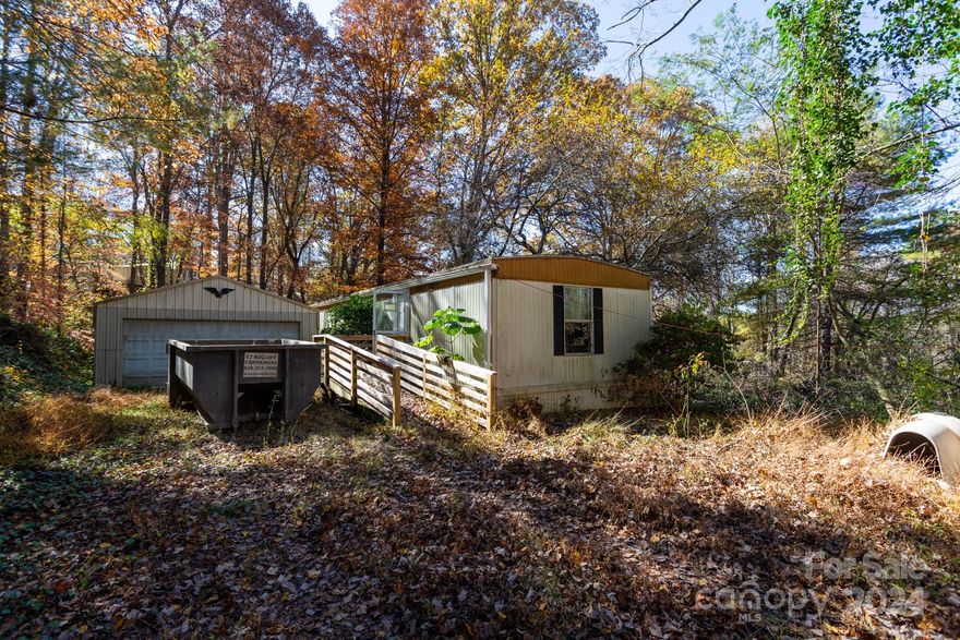 828 Real estate special Operation Daffodil property price drop.  Operation Daffodil is sweeping springtime price drops to get the market moving!!! A decent 1 bedroom 1 bath single wide, buried deep in the woods   on approx 1 acre. with a two car garage and storage shed .  Handicap ramp will lead you into this unique piece of property.  Private, quiet setting for a great home or rental.  Priced to go quickly.  No loan available on this one, cash only.  RMA, and shared well as well as Covenants are in attachments.  Back on the market, Buyer was unable to complete transaction.