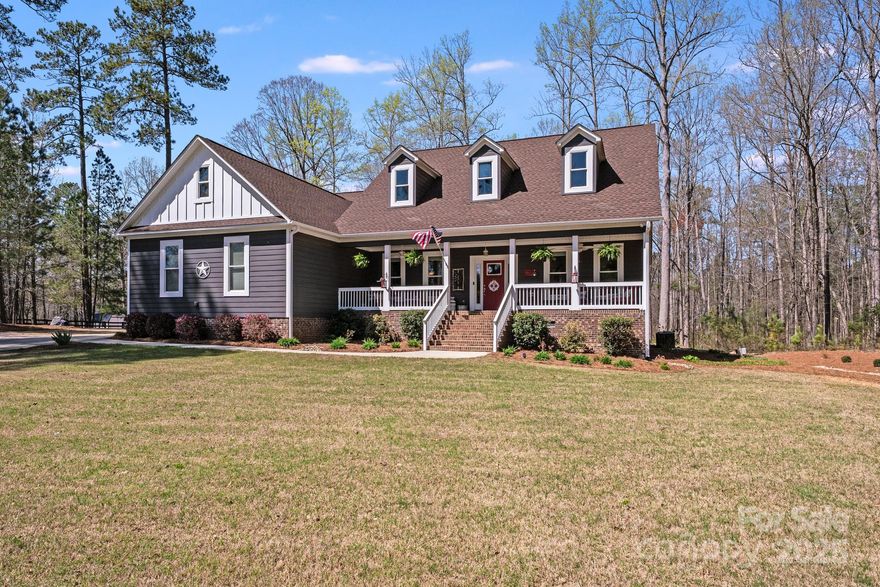 Nestled on a quite side street in this equestrian neighborhood sits this beautiful home with a rocking chair front porch on over 4.5 acres. The open floor plan features a vaulted ceiling in the living room, fireplace, formal and casual dining, as well as open kitchen with large island and walk-in pantry.
4 bedrooms, and 3 full baths.  Primary on the main. En suite bedroom upstairs. Walk through the living room doors to the rear deck overlooking the saltwater pool and oasis of beautiful landscaping, wooded area to watch wildlife. Lots of privacy!  Large storage shed and fenced back yard.  
This sprawling lot is an amazing retreat for nature lovers. Lots of space to spread out.  Bring your boat, RV or horse per lot allowance.  Riding and walking trails stretch for miles.  Relax and enjoy!