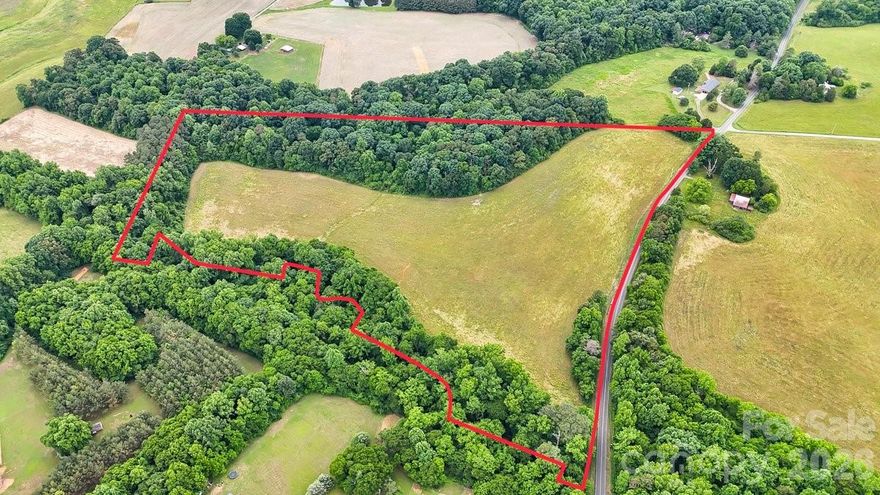 Discover the perfect blend of rural tranquility and development potential with this expansive 28.75-acre parcel lot. Zoned RA this property offers a multitude of opportunities for residential development, agriculture pursuits or a private estate. Nearby attractions include Morrow Mountain State Park just a short drive away this park offers hiking camping and views of Uwharrie mountains. Downtown Albemarle hosts cultural events, local dining and shopping centers. Baldin lake is also nearby giving the chance to enjoy boating, fishing, and water sports on this nearby recreational lake. Road access, direct frontage on Pennington Road. 
This property also offers investment potential for developers, farmers, investors or individuals looking to build a custom home or family compound.