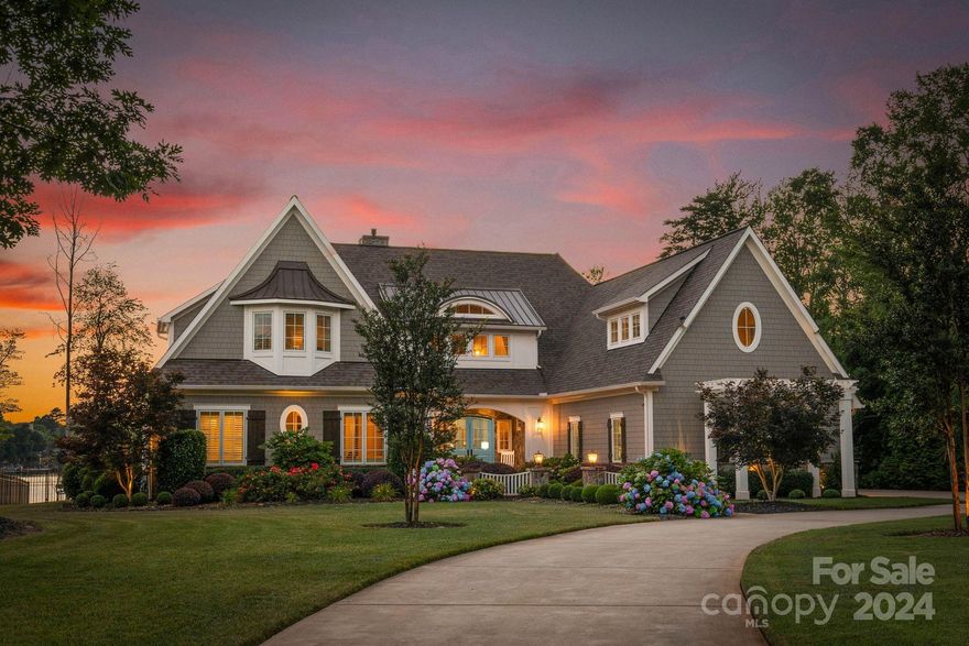 Nantucket meets Lake Norman! Introducing 104 Woods Hole Court in the coveted Village neighborhood in The Point! Be prepared to be amazed by this magnificent waterfront house situated on over 130 feet of shoreline. Upon entry, you’ll be impressed by the open floor plan w/ incredible lake views from nearly every room. The layout offers seamless everyday living with a gourmet kitchen featuring a scullery, inviting keeping room & dining room, relaxing primary retreat, main level office & guest suite. Upstairs you'll find 3 spacious bedrooms, all w/ en-suite baths & walk-in closets, plus 2 bonus spaces & two walkout storage spaces. The quality of construction is unparalleled featuring exposed beams, see-through gas fireplace, wide plank hardwood flooring throughout, built-in closet systems, Thermador appliances & surround sound. The backyard is a dream with saltwater pool & spa, flagstone terraces & expansive lake views! Deeded boat slip is just around the corner. Lake living at its finest!