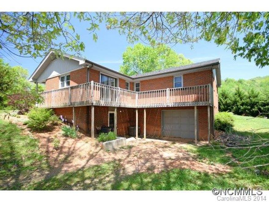 Gorgeous Reems Creek mountain view setting is lovely backdrop for this 3/3 ranch just off Reems Cr Rd. Open kitchen living area perfect for entertaining with impressive Bosch gas range and dual Kenmore ovens - attractive for aspiring chef/foodie!  General areas mostly hardwood, 4 bedrooms (3BR septic). Extra space in lower-levl part finished (not included in finsqft) could be in-law suite or apartment complete with 3rd full bath. 15min to AVL!