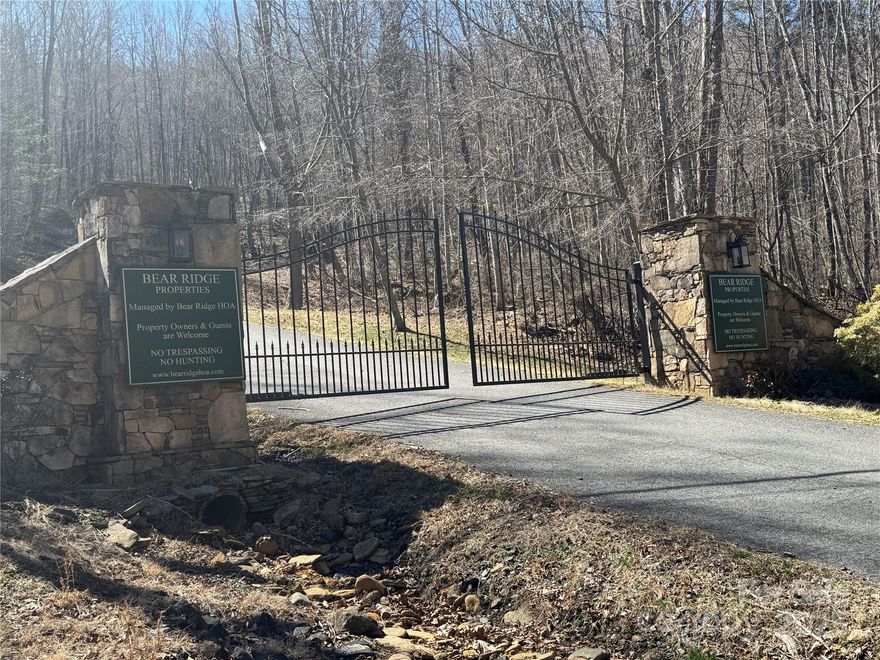 Escape to your own private retreat on this wooded lot with stunning mountain views. Situated at an elevation of over 3,500 feet, this property offers the perfect blend of seclusion and accessibility. Enjoy the convenience of an easily accessible gravel road leading to the gated entrance, ensuring privacy and security. Little Rock Creek flows at the entrance, nestled at the base of the mountain, providing a peaceful atmosphere. A covered picnic area near the creek offers the ideal spot to relax and enjoy the natural surroundings. Adjacent lots are available for purchase, offering even more possibilities for expanding your space or securing additional privacy. The property is part of a well-maintained development with thoughtful restrictions to preserve the integrity and value of the area. Whether you're looking to build your dream home or simply enjoy the peaceful surroundings, this lot offers an exceptional opportunity to embrace nature while remaining close to essential amenities.