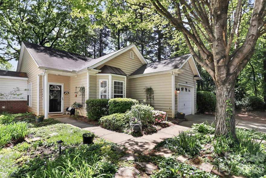 From the moment you arrive, this yard will capture your heart. Discover the charm of vibrant perennial gardens that welcome you home. Step inside to an airy family room accented by gas log FP with tile hearth.  The room flows into the spacious DR accented by a custom wine bar area. The custom kitchen offers a beautiful breakfast bar with granite counter tops, and open cabinet concept. Any chef will love the gas cook top double convection oven. On those chill fall /winter days, enjoy the heated travertine tile kitchen floor! The primary bedroom has lots of natural light with custom wood framed windows, plus BRAND NEW LVP floors.  Enjoy the custom primary bath with oversized tiled walk-in shower plus custom vanity and cabinets. The primary bathroom also has heated floors for those chilly days .The secondary bedrooms are good size, with one currently being used as an office.  Step out to the rear yard where towering mature trees provide a natural canopy over the expansive TREX deck and patio area. Perfect for morning coffee or a relaxing sunset dinner. This home offers a rare sanctuary from the everyday hustle. Welcome home !