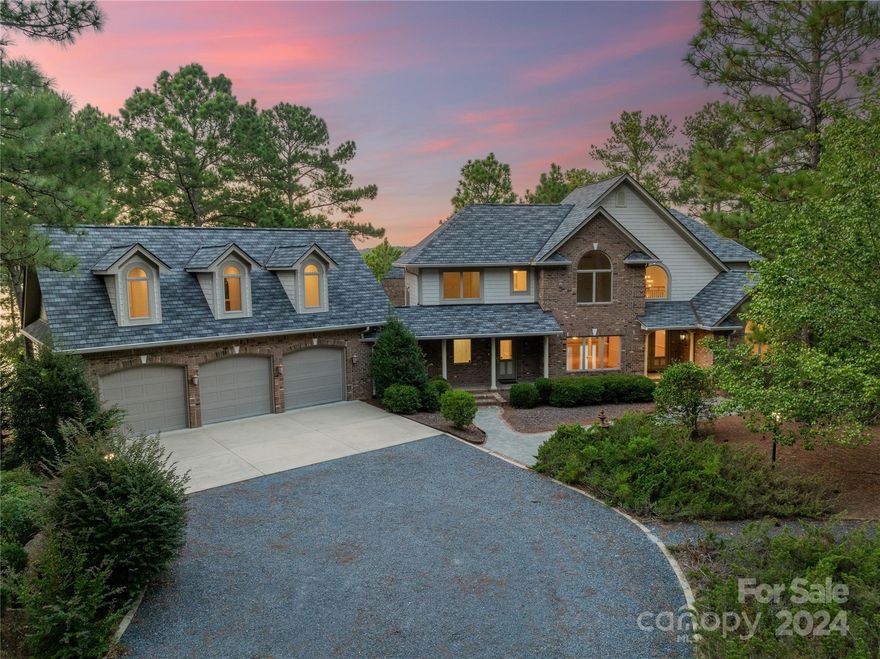 Experience luxury and privacy at this waterfront estate in the prestigious Seven Lakes West gated community. Overlooking the pristine 1,000-acre Lake Auman, this all-brick, 5-bedroom residence offers approx. 8,500 total sq. ft. of crafted living space. Set on a premier cul-de-sac lot with northern exposure, the estate features 300 ft of private lake frontage.

Designed by Yates Hussey Construction Inc., this 3-level home spans 2.35 acres across four combined parcels including 5 bedrooms, 6.5 bathrooms and detached guest retreat with its own kitchen, bath, and living area. Features three fireplaces, movie theater, heated workshop, ample storage, a 21-zone irrigation system and sound system. Recent updates feat. new carpet and fresh paint (Sept 2024).

The estate's tranquility is enhanced by community covenants that prohibit jet skis.