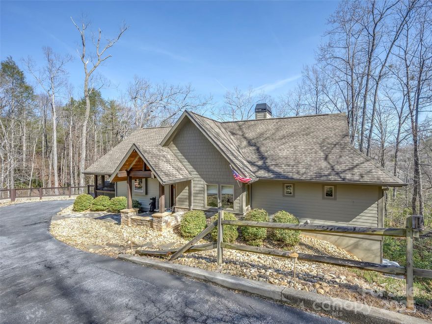 Turnkey lakefront retreat ready for immediate enjoyment! The inviting open floor plan is comfortable and stylish. The spacious main level primary suite features two closets and an ensuite bath. The chef’s kitchen is fully equipped with top-tier appliances — ideal for entertaining. Outdoor relaxation is effortless with a massive screened porch on the main level and two decks off the basement, all offering serene lake views. Just steps from the home, your private dock and 167 feet of lake frontage provide direct access to Shumont Lake. Whether you love kayaking, canoeing, fishing, or stand-up paddleboarding, this non-motorized lake offers the perfect setting to soak in the natural beauty. Nestled in a private setting with a fenced yard, this home also provides access to Rumbling Bald’s premier amenities, including a community beach, two golf courses, multiple pools, a fitness center, spa, marina, tennis courts, restaurants, and walking trails — all just a golf cart ride away!