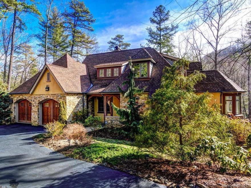 Best value in The Cliffs at Walnut Cove. Freshly painted, light and bright, four-bedroom English cottage style home. Located on 1.6 acre creek-side lot. Move-in ready. This one won't last long!