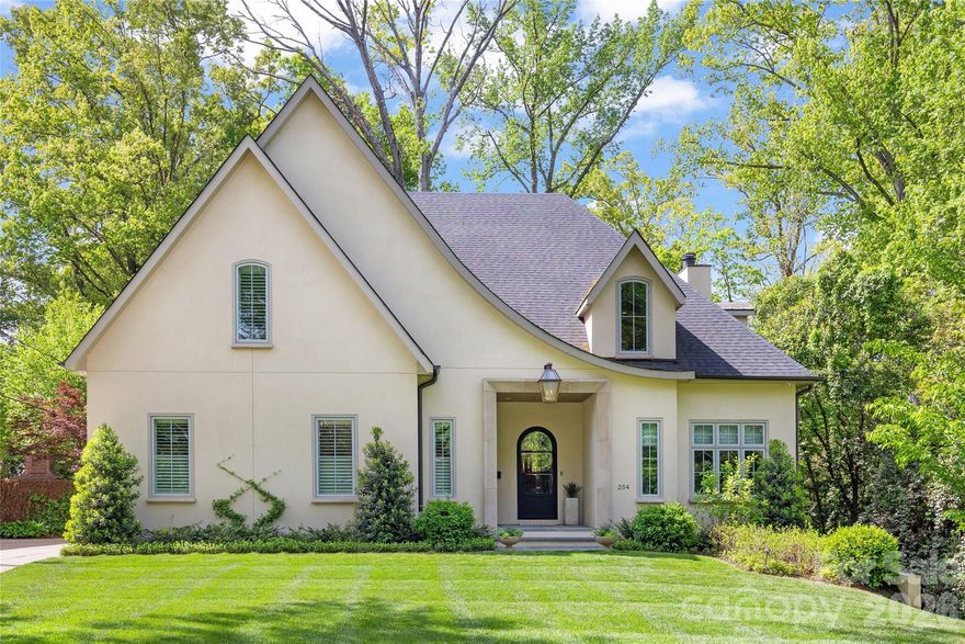 Stunning custom home in the heart of Eastover, built by Knight Construction in 2022 and thoughtfully designed with exceptional detail and designer-grade finishes throughout. Situated on a .37-acre lot, this 6BR/5.5BA residence offers over 5,200 sq/ft across 3 beautifully finished levels. Open main level features white oak hardwoods, gracious foyer, and incredible kitchen with custom cabinetry, quartz surfaces, waterfall island, and top-tier appliances including ILVE gas range. Generous family room with coffered ceiling and cast stone fireplace and office/guest room with en-suite bath. The dining room with built-in bar flows seamlessly to a covered rear porch with vaulted ceiling, fireplace, and grilling area—all overlooking the turfed rear yard with new fencing and lush landscaping. Luxurious primary suite with spa-like marble bath and expansive custom closet. Upper level offers 3 spacious secondary bedrooms and bonus room, while the impressive lower level includes a rec room, exercise room, guest suite, and abundant storage.  Live next to neighborhood parks, shops, grocery, and dining; absolutely unbeatable location in one of Charlotte’s most desired neighborhoods!