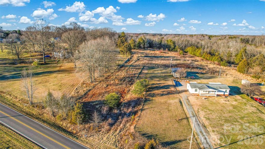 Rare opportunity to own an almost 5-acre parcel in a prime Mooresville location with no HOA and no restrictions. This versatile property offers excellent potential for a private estate, mini-farm, or possible subdivision, subject to county approval. A previous perc test is available, providing added confidence for future development. The land offers a desirable balance of privacy and accessibility, with convenient proximity to shopping, dining, schools, and major roadways. A unique opportunity to secure acreage with flexibility and long-term value in one of Mooresville’s most sought-after areas.