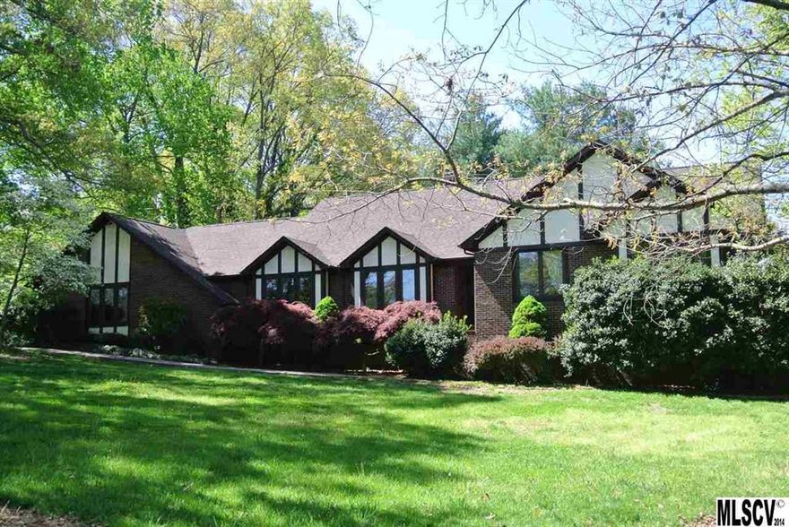 Well maintained English Tutor home located on golf course in Rock Barn on the 14th green. Home has lots of space w/ like new wood floors throughout & carpet in bedrooms. Tile in bathrooms. Two large living areas that have double sided rock fireplace w/ built-in shelves.  Large kitchen w/ island, lots of cabinet space & large walk in pantry for storage.  Also has a nice formal dining area off kitchen.  Home includes security system & geothermal heat pump. Basement not included in heated SqFt, includes room for that in-law apartment that has its own private entrance or bonus area. (3rd bathroom completed & small kitchen in basement) Sunroom has its own unit for heat and ac. plus a large deck off from it. Geothermal system is solar & heats water & house.  NEW ROOF 2014 home priced BELOW TAX VALUE.