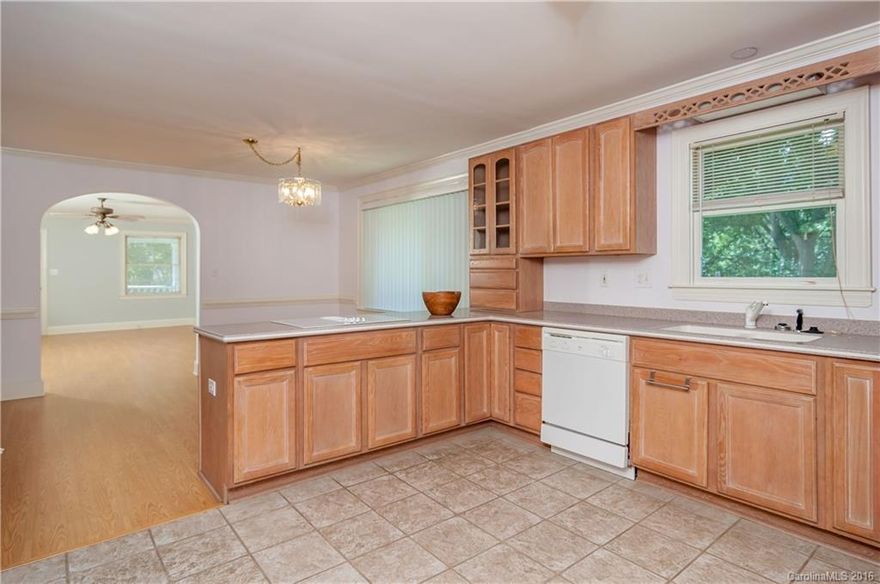 Very open floor plan with large internal layout and unique original archways. There is  Master bedroom suite with Jacuzzi tub and 2nd bedroom with full bathroom located off of hallway.    The room off of back door entrance has a closet and could be smaller 3rd bedroom or office.  Home is available for short term rental(minimum 6 months).  Furnished or Unfurnished short term.  Home is across the street from the VanLandingham estate.  Utilities are gas, water and electric.