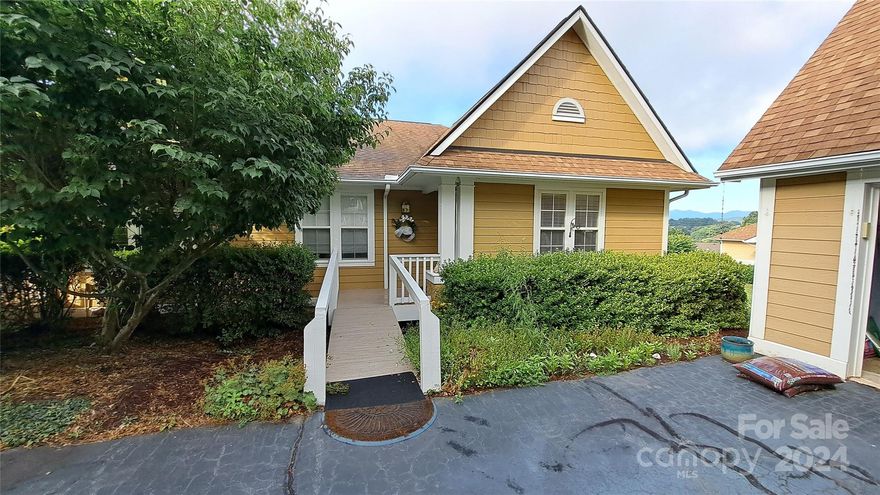 Welcome to the best of Biltmore Commons in Asheville/Candler North Carolina. 
Exceptional single-level living at a reasonable cost.  This townhome boasts the best mountain/sunset views in the entire development. Updated with too many upgrades to list here. Full printed list of upgrades will be provided at your viewing appointment.   Great lighting all day, year round sunroom, elevated wood deck, and huge Smoky Mountain panorama.   Large comfortable rooms, 2 en-suite bedrooms and a third bedroom for office, guests or home theater. Oak cabinets throughout and large closets with storage galore.   Filled with light and move in ready for your mountain living experience. Fireplace 2 car garage including 2 shelved closets and floored attic storage as well. Handicap accessible. Clubhouse, exercise room,  new pool, sunbathing decks, basketball and tennis. Literally 10 minutes to downtown and 15 minutes to the airport, all medical and shopping.  Don't wait long on this one. It will be gone.