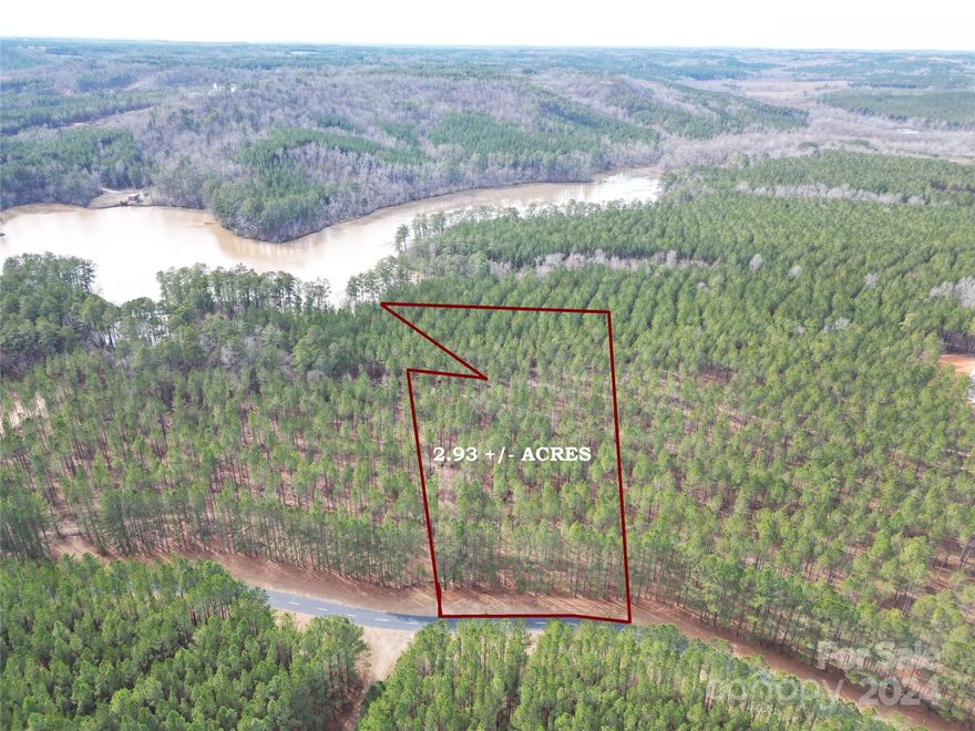 Huge 2.93 ACRE WATERFRONT LOT IN GATED BLEWETT FALLS LAKE NEIGHBORHOOD!  Build your dream home or weekend getaway on the Lake!  Relatively flat lot with a gentle slope to the water.  Spencer Pointe offers lots of outdoor recreation.  Walking the private roads throughout the neighborhood overlooking Blewett Falls Lake,  Swimming, Fishing, hunting, boating and/or water skiing.  Located within 15 minutes of the 8,500 AC Pee Dee National Wildlife Refuge.  Also conveniently located 2 hours from the beach and 2.5 hours from the mountains.

Buyer responsible for soil evaluation & county permitting required for construction.