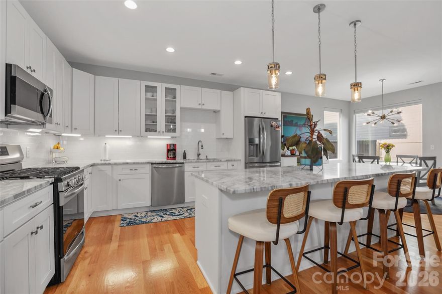 Tucked into Biddleville, this 3-bed, 2.5-bath home gets the balance right: modern enough to feel fresh, comfortable enough to actually live in. Hardwood floors run throughout (except the bathrooms), and every bedroom has a walk-in closet.

The kitchen is built around an oversized island. The kind where you can prep dinner, pay bills, or let people hang out without feeling like they're in your way. It's open to the living and dining area, so the whole main floor feels open without being echoey.

Then there's the rooftop terrace. Skyline views, plenty of space, and honestly, it's hard not to spend most of your time up there. Morning coffee, evening drinks, or just sitting outside without having to leave your house. It's the kind of thing you didn't know you needed until you have it.

Location-wise, you're in the middle of it all. Newly Michelin recommended Restaurant Constance, Pizza Baby, Not Just Coffee, Rhino Market, the greenway, all close by. Uptown's a few minutes away when you want it, but Biddleville has its own sense of community. It's one of those neighborhoods where new construction is popping up and prices are climbing, but you can still get in before it's completely out of reach.

If you've been waiting for the right spot in Charlotte, this might be it.