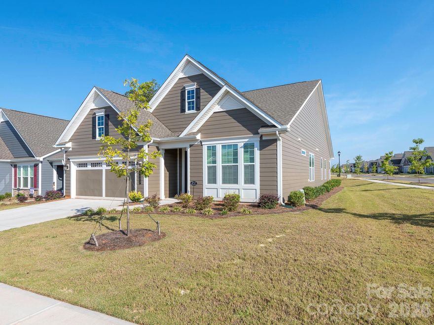 Rare opportunity on an oversized corner lot in Cresswind Charlotte. This beautifully maintained 2024 Laurel floor plan offers exceptional value with a price per square foot below the community average and a lot that is approximately 25 percent larger than many standard homesites.

This popular Laurel design features 2 bedrooms plus a private office/flex room and blends thoughtful design with easy everyday living. From the moment you walk in, you’re welcomed by an inviting foyer with a tray ceiling that opens to a spacious, light filled living and dining area.

The open concept layout flows seamlessly into the gourmet kitchen, featuring quartz countertops, a large island perfect for entertaining, and a walk in pantry. Whether hosting friends or enjoying a quiet evening at home, the space is designed to feel comfortable and connected.

The primary suite is a relaxing retreat with a tray ceiling, walk in closet, dual quartz vanities, and a beautifully tiled frameless shower. A secondary bedroom and full guest bath provide a comfortable space for visitors, while the private flex room with French doors is perfect for a home office, hobby space, or additional guest room.

One of the standout features of this home is the oversized corner homesite, offering more space and privacy than many homes in the neighborhood.

Located in the award winning 55+ community of Cresswind Charlotte, residents enjoy an active lifestyle with exceptional amenities including indoor and outdoor pools, a clubhouse, fitness center, pickleball and tennis courts, bocce, billiards, and a full calendar of activities led by the on site lifestyle director.

Conveniently located near Mint Hill, Matthews, Concord, and Uptown Charlotte, you’ll have easy access to shopping, dining, and medical facilities while still enjoying the peace and community of Cresswind living.