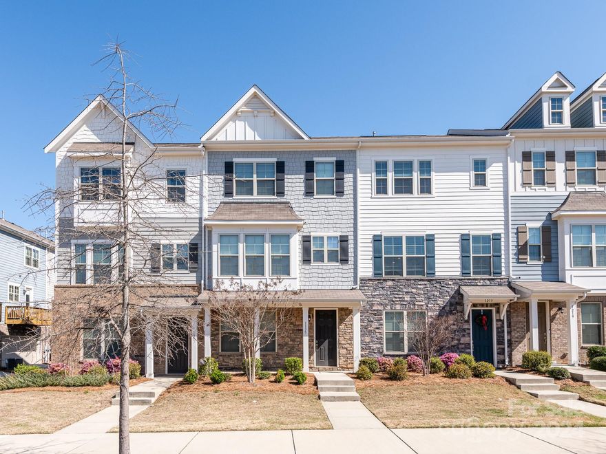 Beautifully bright & open 3 story townhome just steps away from the Arrowood Light Rail Station w/ quick and easy access into Uptown Charlotte. Community amenities include outdoor pool with cabanas, changing rooms, gas grills and sun-shelf, perfect for hosting family & friends during the warmer months. 2-car attached garage for parking on lower level plus full bedroom w/ bath perfect for guests or home office / bonus room. Main level welcomes you with fully open living, dining & kitchen area plus balcony access. Kitchen includes island for additional seating, granite counters, SS appliances including gas range & double oven, walk-in pantry & tons of cabinets for storage. Top floor holds primary bedroom w/ tray ceilings & luxurious full bath w/ dual sinks & oversized walk-in shower & closet. 2nd upstairs bedroom also has attached bath w/ walk-in shower. Quick access into town via Charlotte Light Rail system and just minutes from Southpark, Pineville, Airport & Outlets. A MUST SEE!