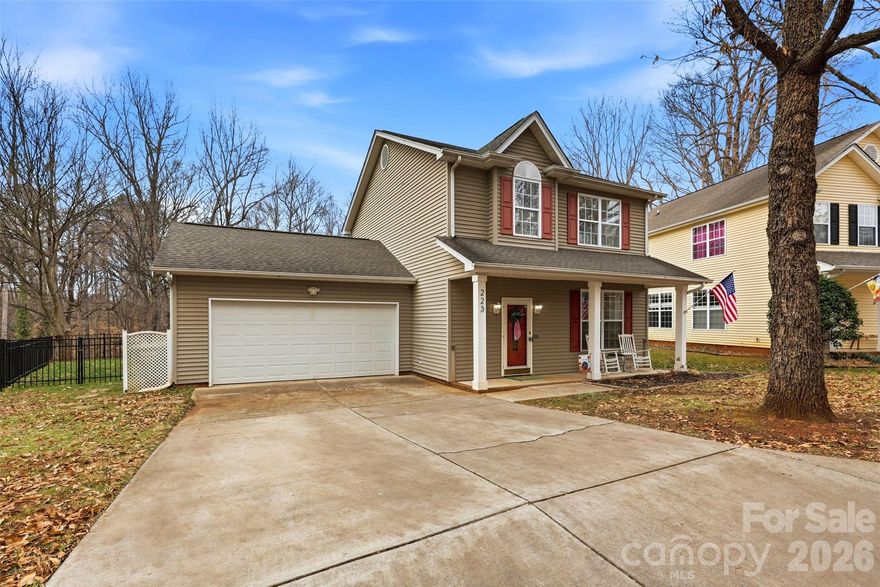 Tucked away just minutes from downtown Belmont, this beautifully updated 3-bedroom, 2.5-bath home offers the perfect blend of charm, privacy, and everyday functionality. Step inside to a light-filled living space that flows seamlessly into the dining area and updated kitchen, complete with tile backsplash, stainless steel appliances, a rolling island, and pantry for extra storage.

Upstairs, the spacious primary suite features a walk-in closet and a beautifully refreshed bath with dual vanities, quartz countertops, and a tiled shower. Secondary bathrooms have been thoughtfully updated, and the nursery adds a special touch with classic wainscoting detail.

Out back is where this home truly shines — a screened-in porch and expansive deck overlook mature trees and walking trails, creating a peaceful, private setting that’s perfect for morning coffee or weekend gatherings. The flat, fenced backyard offers plenty of space to relax, play, or entertain.

Move-in ready and backing to greenspace for added privacy, this home combines style, comfort, and location - you don't want to miss this one!