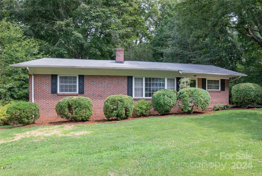 A $10,000 price adjustment on this great property.  Located in the downtown area of Morganton...5 minutes by car; 10 minutes by bike and 15 minutes by foot!  This traditional ranch style brick home offers 3 bedrooms and 2 full baths.  The traditional living room greets you as you enter the front door, offering large windows, built ins and a wood fireplace (currently has a hood). A perfect place for gatherings with family and friends.  The dining area can play host to formal dining and a simple breakfast nook.  The galley kitchen is open to the breakfast area and offers plenty of counter space and soft close drawers. The backyard is fenced in. The partially finished basement area offers heating and cooling and can be used in a variety of ways.  Call and let's set up a showing today.