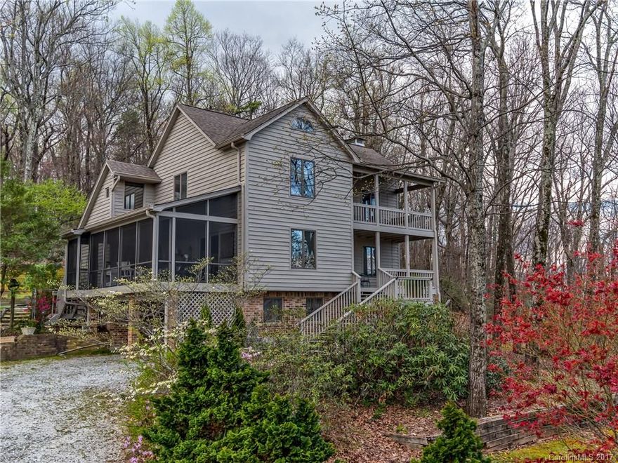 Quality craftsmanship abounds in this mountain home with long range views!  This ideal spot has privacy, peace & quiet in a natural wooded setting with flat & fenced yard.  Home has open kitchen/dining room w/cathedral cedar beam ceiling, main level master BR, 3BR's & office on 2nd level, bsmt w/bonus Rm.& workshop. Covered porches, deck invites the outdoors in. Total sq ft under roof is 3211. Enjoy long range views & starry nights.  Walk to the lake for swimming. Secluded, yet minutes to Tryon.