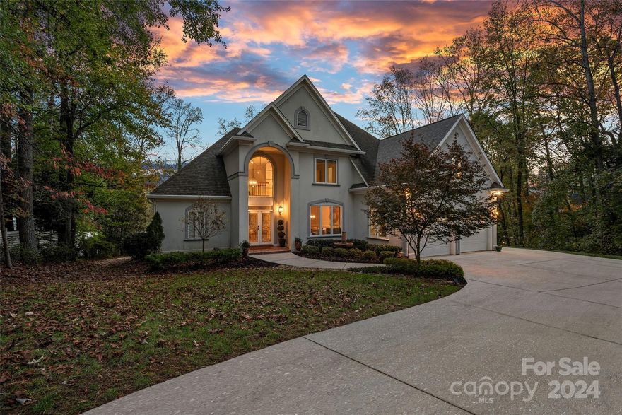 Welcome to your stunning lakeside retreat situated along the shores of Lake Norman with NO HOA on a sizable private lot. This thoughtfully designed home perfectly blends luxury with functional waterfront living. Entering in the grand 2-story entry you’ll immediately be greeted with expansive lake views from the panoramic windows in the light filled great room complete with built ins & a cozy gas fireplace. Ideal open floor plan flows seamlessly into your dining room and leads into the updated kitchen featuring a breakfast bar, granite countertops and sunny dining area. Spacious primary suite on main is complete with a spa style bath, walk-in closet and boasts scenic lake views with direct access to large back deck. Upstairs you’ll find 2 ample sized bedrooms each with a full bath and huge bonus room. Relax and take in the views from the deck, around the fire pit, on your private dock with sitting area and covered boat slip or from your coveted boat house offering endless opportunities!