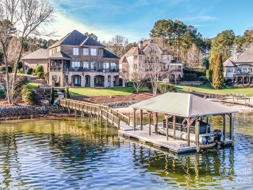 Welcome home to Lake Norman! Amazing main channel views, quality construction and materials throughout.  Thoughtful layout and meticulously maintained home in desirable Northview Harbour.

This home boasts a full brick and stone exterior, beautiful 2 story great room with a stone fireplace from floor to ceiling and open concept living. The kitchen offers abundant cabinet space, spacious island, walk in pantry and new gas cook top.

The Fully finished walkout lower level feels like another entire home with its 11 ft ceilings, full kitchen, bedroom, bathroom, living and dining areas as well as 3 large storage areas.

The outdoor living space includes the screened porch, full main level balcony, full covered lower-level patio with fire pit area, wonderful sandy beach and a covered boat house with lift.

The Northview Harbour Community features a pool, tennis courts, clubhouse, nature trail, dry boat storage, community boat ramp, and playground.
