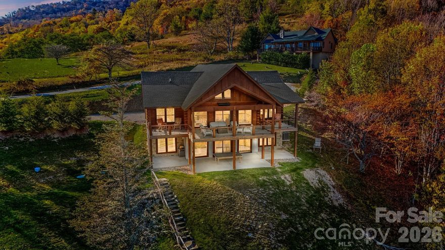 "Escape to 'Amazing View Lodge,' a big, beautiful 4-bedroom 4.5-bathroom (each bedroom has an ensuite bathroom) cabin where luxury meets the landscape in perfect harmony. This custom-built retreat offers an experience beyond compare, with a sprawling deck that serves as your private viewing platform for stunning mountain views and stargazing, or enjoy an evening with a warm fire, crisp air, and endless skies at the firepit. Inside, a stone fireplace and rich wood finishes create a cozy yet grand atmosphere, while multiple living spaces provide ample room to relax and reconnect. A kitchen designed for both serious cooking and relaxed gathering, it boasts a spacious layout with a generous island, a gourmet range, and custom Koch rustic cherry briarwood cabinetry. The lower-level offers a sprawling family-friendly oasis designed for both relaxation and entertainment. Gather around the cozy fireplace for a movie night or head to the dedicated game area for endless fun. This impressive space is complemented by two bedrooms, each with its own full en-suite bathroom. From the moment you arrive, you'll be immersed in a world of tranquility, framed by some of the most amazing views the region has to offer." Located in Banner Elk minutes to downtown, Beech Mountain and the area ski resorts! An incredible home built with superior wall foundation, 8" easter white pine double V authentic exterior corners, all logs are clear treat pressure treated at factory, spray foam insulation on roof deck for exceptional insulation values, a Generac 22kw whole house backup generator serviced annually, whole house dehumidification tied into the HVAC system. Short-term rental projection up to 65K! A truly gorgeous mountain home awaits you! Furnished with a few exceptions! Seller is an NC Broker