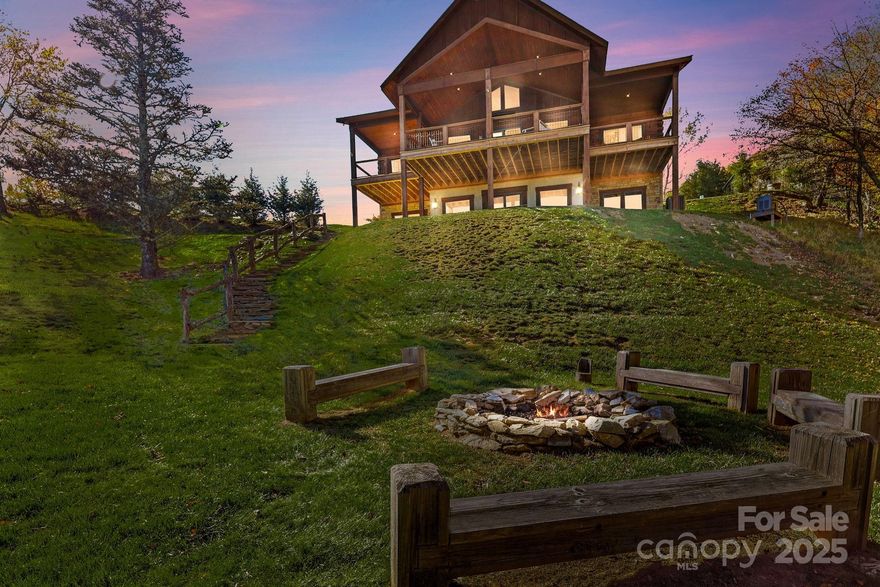 "Escape to 'Amazing View Lodge,' a big, beautiful 4-bedroom 4.5-bathroom (each bedroom has an ensuite bathroom) cabin where luxury meets the landscape in perfect harmony. This custom-built retreat offers an experience beyond compare, with a sprawling deck that serves as your private viewing platform for stunning mountain views and stargazing, or enjoy an evening with a warm fire, crisp air, and endless skies at the firepit. Inside, a stone fireplace and rich wood finishes create a cozy yet grand atmosphere, while multiple living spaces provide ample room to relax and reconnect. A kitchen designed for both serious cooking and relaxed gathering, it boasts a spacious layout with a generous island, a gourmet range, and custom Koch rustic cherry briarwood cabinetry. The lower-level offers a sprawling family-friendly oasis designed for both relaxation and entertainment. Gather around the cozy fireplace for a movie night or head to the dedicated game area for endless fun. This impressive space is complemented by two bedrooms, each with its own full en-suite bathroom. From the moment you arrive, you'll be immersed in a world of tranquility, framed by some of the most amazing views the region has to offer." Located in Banner Elk minutes to downtown, Beech Mountain and the area ski resorts! An incredible home built with superior wall foundation, 8" easter white pine double V authentic exterior corners, all logs are clear treat pressure treated at factory, spray foam insulation on roof deck for exceptional insulation values, a Generac 22kw whole house backup generator serviced annually, whole house dehumidification tied into the HVAC system. Short-term rental projection up to 65K! A truly gorgeous mountain home awaits you! Furnished with a few exceptions! Seller is an NC Broker