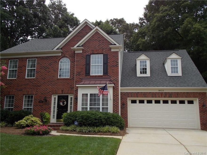 Beautiful 2 story with mature landscaping and wooded lot. Updated home in move-in condition, shows like a model home. Hardwood floors throughout 1st floor, with granite counters and stainless appliances in kitchen. Formal dining room and living rm/study/office. Open great room to spacious kitchen with eat-in area, butlers pantry, separate laundry room. Screened porch with deck off kitchen in fenced, wooded backyard. Master bath with custom tile shower, soaking tub, and granite counter.